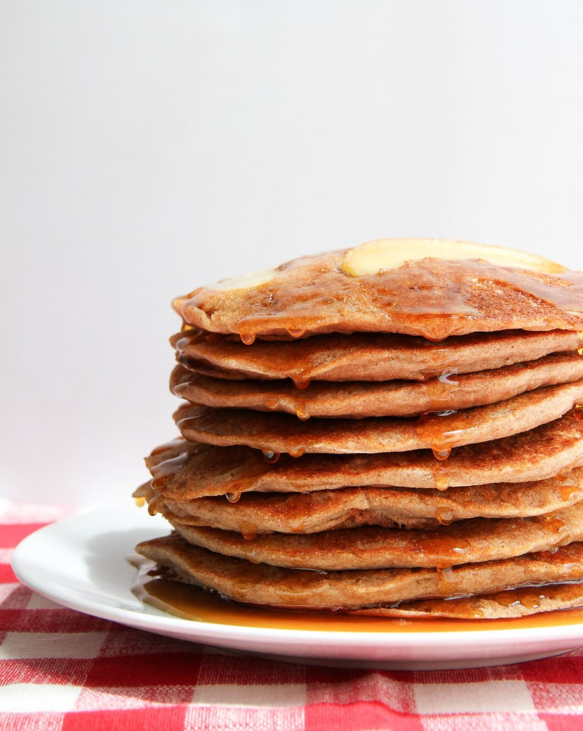 head on view of stack of applesauce pancakes on a plate.