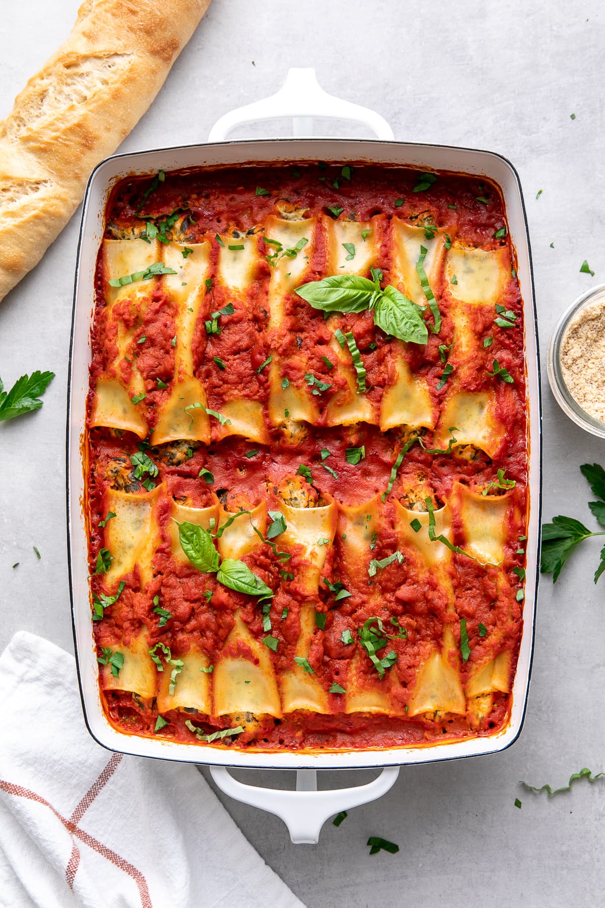 top down view of freshly baked vegan cannelloni in a baking dish.