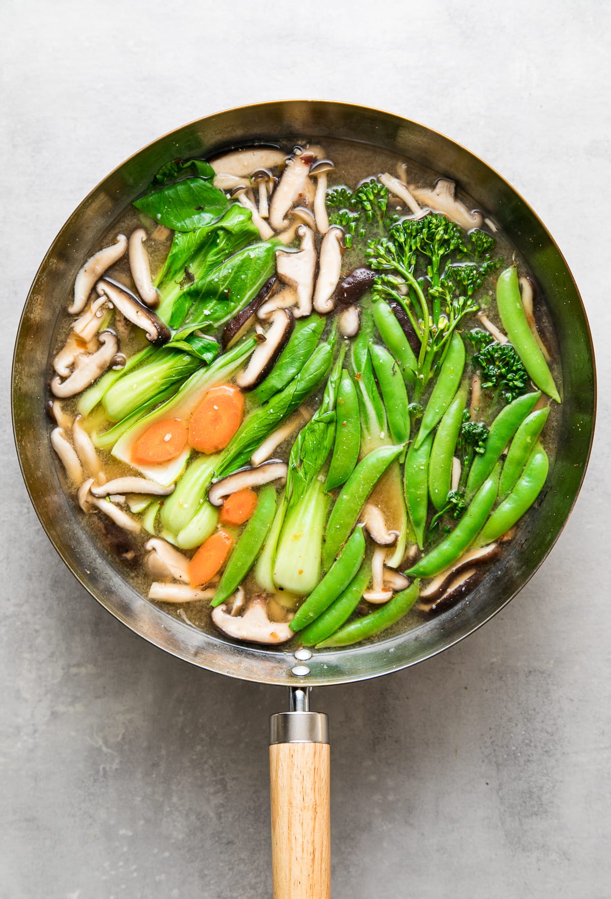 top down view of a wok with freshly made vegetable miso soup.