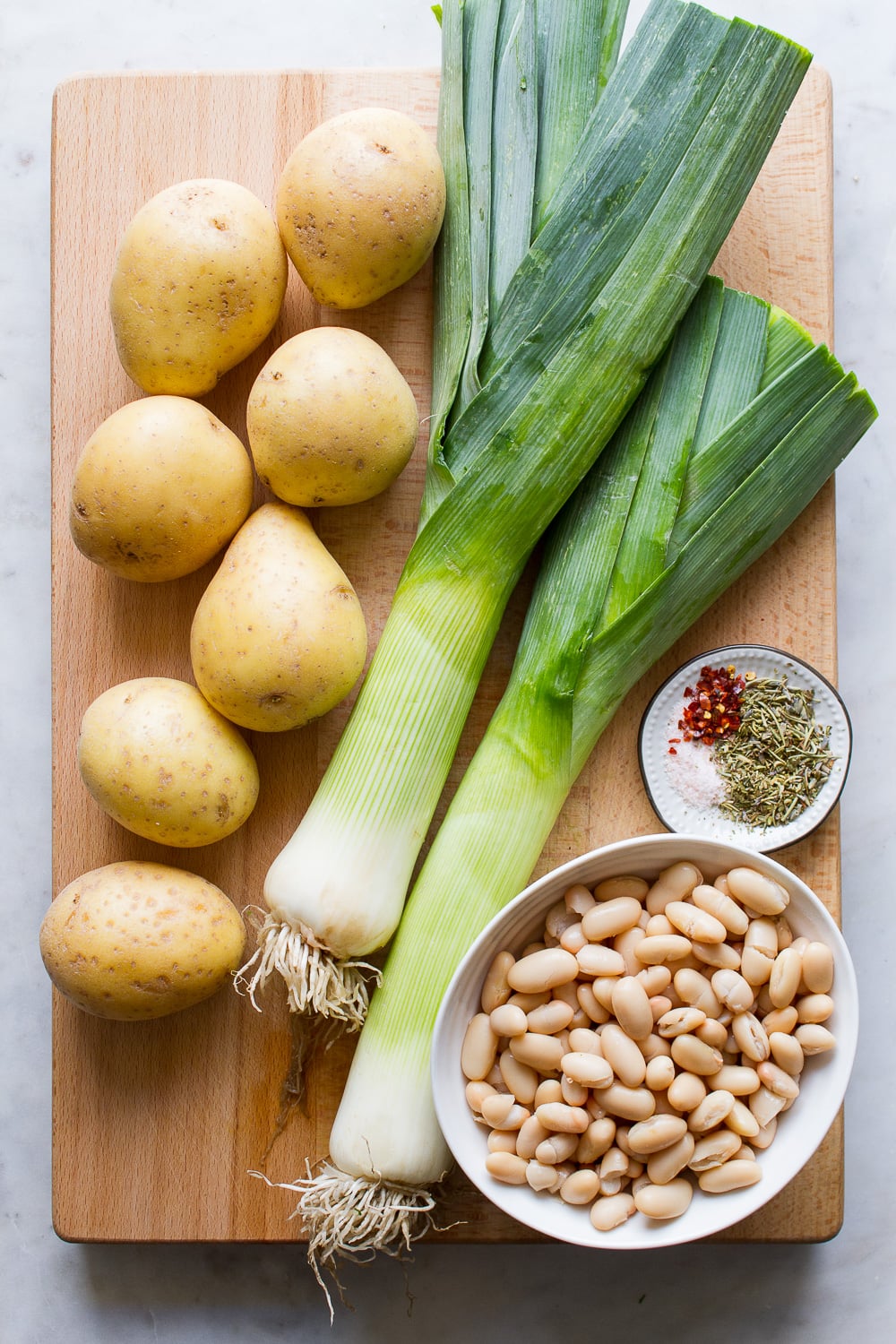 top down view of the ingredients used to make potato, leek and white bean soup.