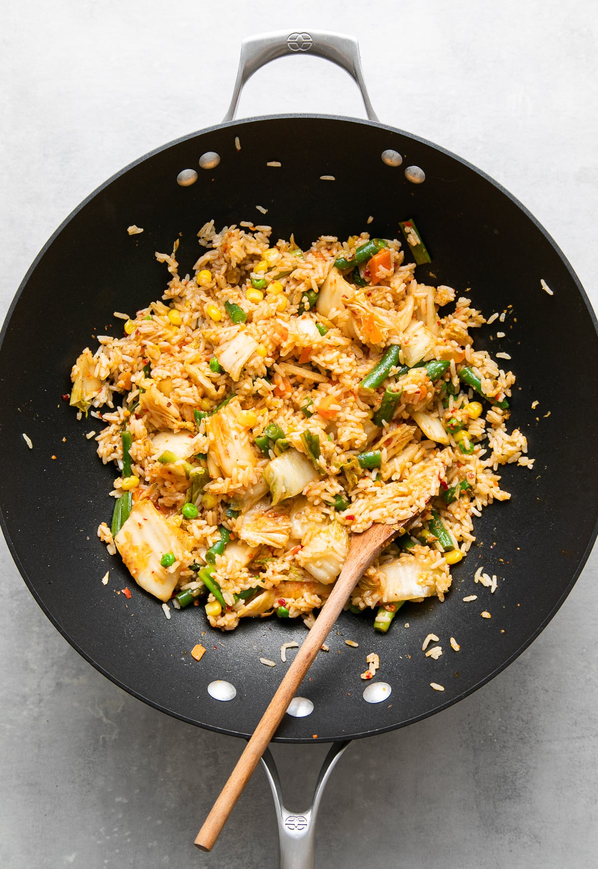 top down view of freshly made kimchi fried rice in a wok.